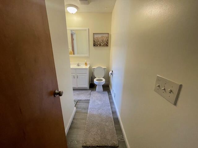 bathroom featuring vanity and toilet