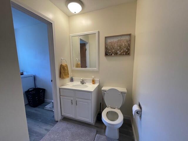 bathroom with toilet and vanity