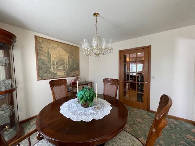 dining area with a chandelier