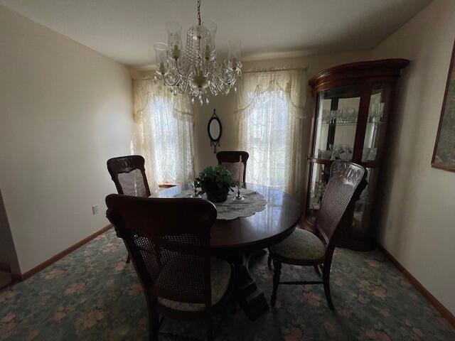 dining room featuring a chandelier