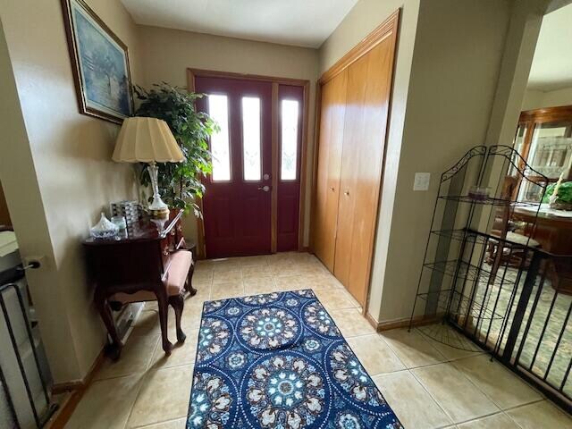 entrance foyer featuring light tile patterned flooring