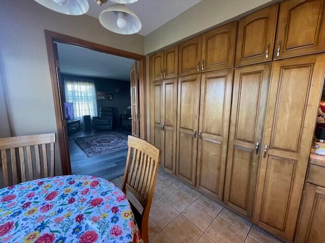 bedroom with a closet, ceiling fan, and light hardwood / wood-style floors