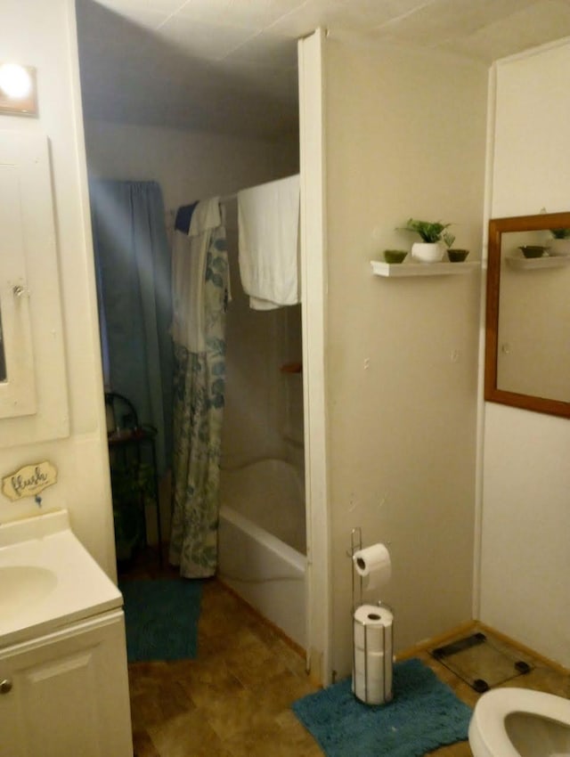 full bathroom with shower / tub combo, vanity, and toilet