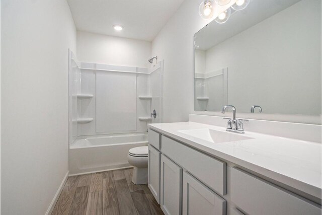 full bathroom with toilet, shower / bathtub combination, wood-type flooring, and vanity