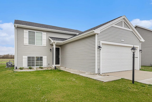 view of front of property with a garage and a front lawn