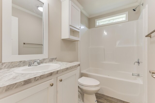 full bathroom with toilet, crown molding, vanity, bathtub / shower combination, and wood-type flooring