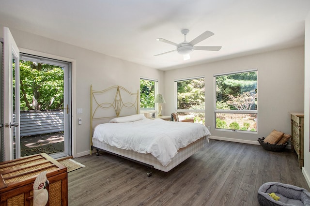 bedroom with ceiling fan, dark hardwood / wood-style flooring, and access to outside