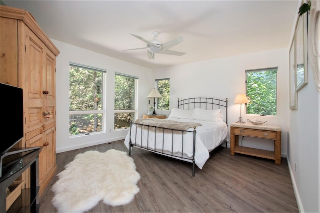 bedroom featuring ceiling fan and dark hardwood / wood-style floors