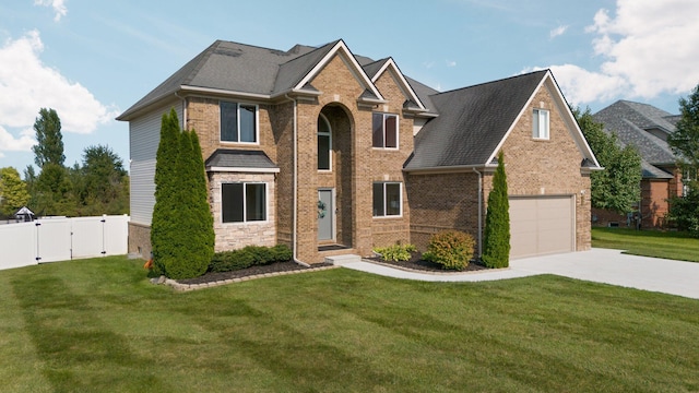 view of front of house featuring a garage and a front lawn