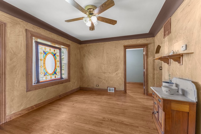 interior space featuring light wood-type flooring and ceiling fan