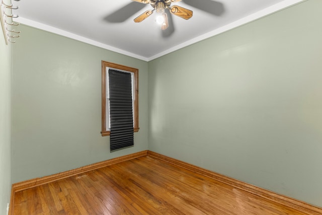 spare room featuring ornamental molding, hardwood / wood-style floors, and ceiling fan