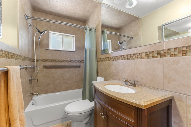 full bathroom with vanity, toilet, shower / tub combo, and tile walls