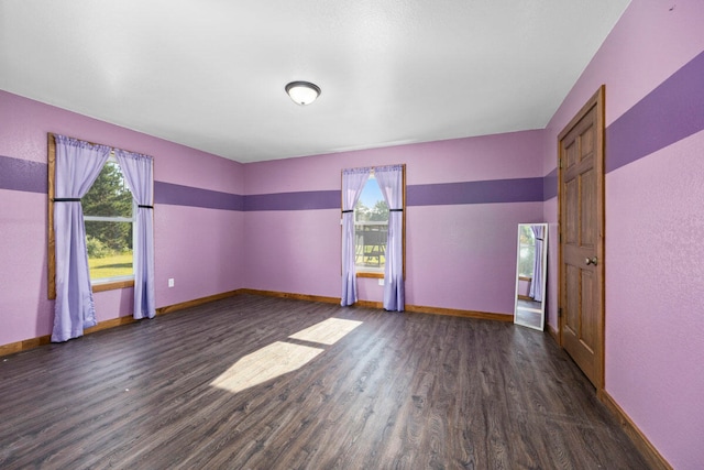 spare room featuring dark hardwood / wood-style floors