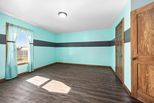 unfurnished room featuring dark hardwood / wood-style flooring