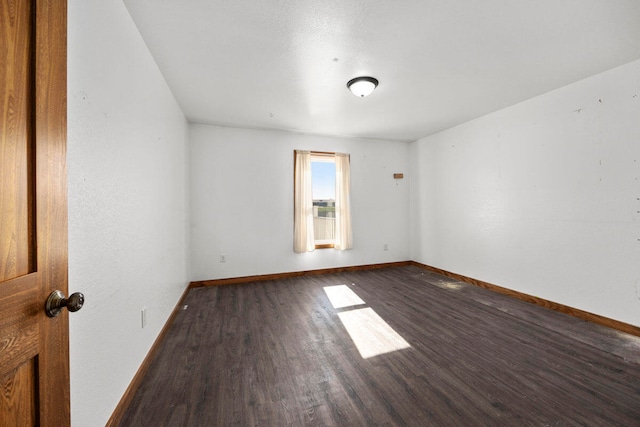 spare room with wood-type flooring