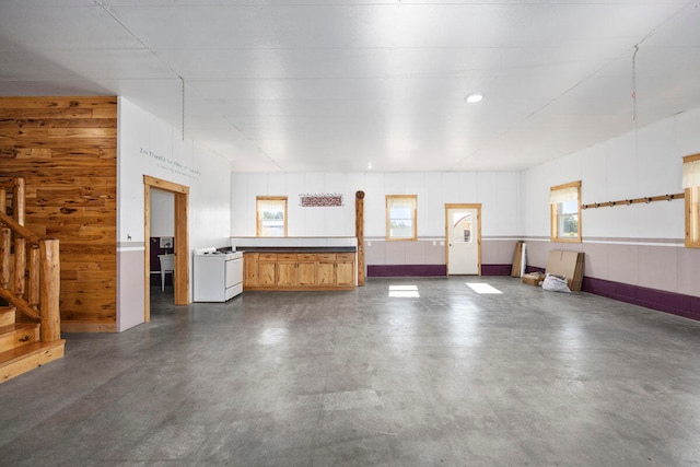 garage featuring wooden walls