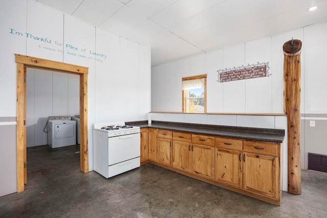 kitchen with gas range gas stove and washing machine and clothes dryer