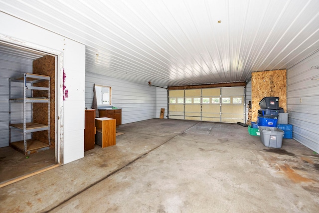 garage featuring wood walls