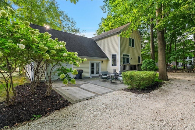 rear view of house with french doors and a patio area