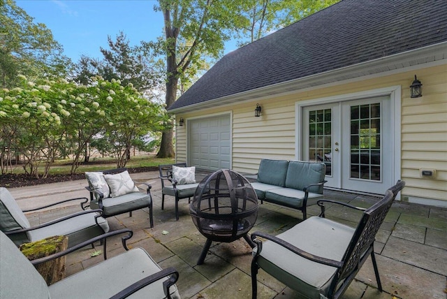 view of patio / terrace with an outdoor living space with a fire pit