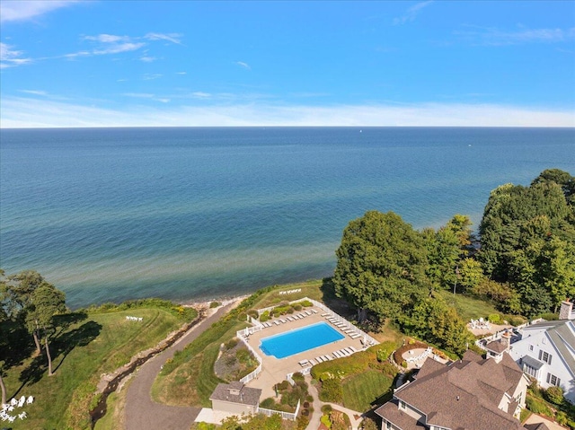 birds eye view of property with a water view