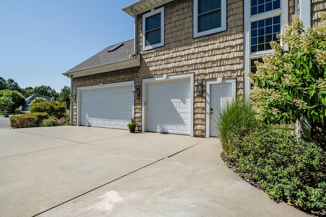 view of property exterior with a garage