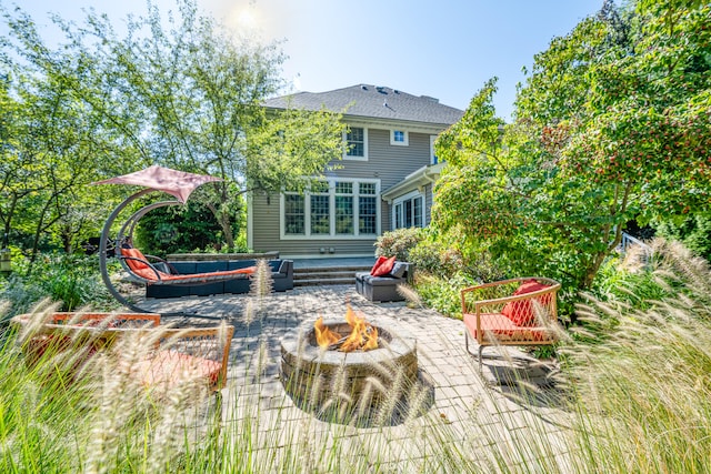 view of patio / terrace with an outdoor fire pit