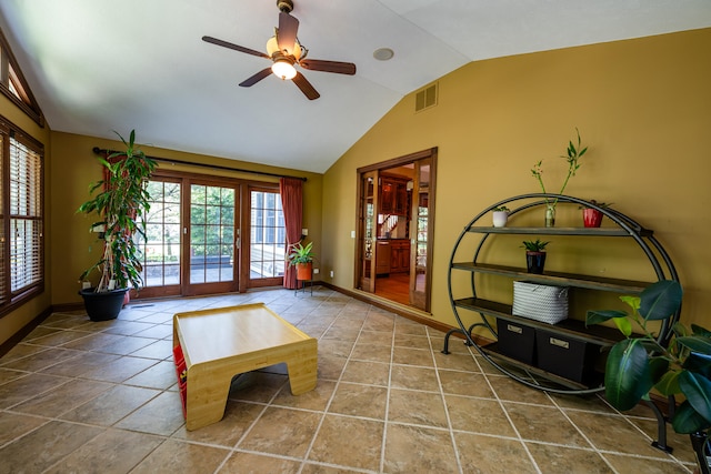 interior space featuring lofted ceiling, ceiling fan, and a wealth of natural light