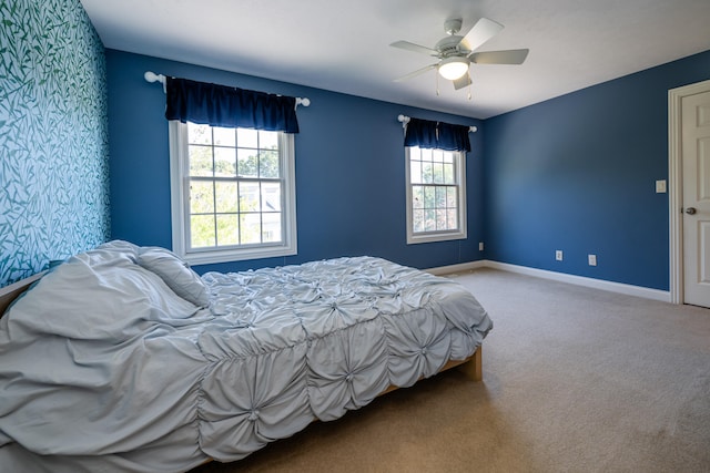 bedroom featuring ceiling fan and carpet floors