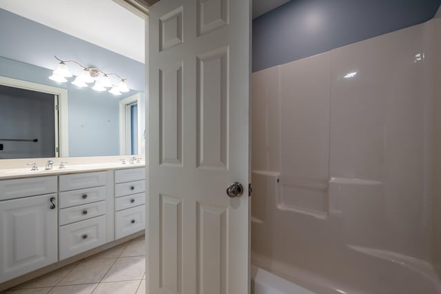 bathroom with vanity, plus walk in shower, and tile patterned floors