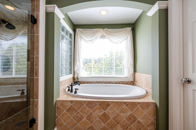 bathroom featuring separate shower and tub