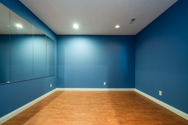 spare room featuring light hardwood / wood-style flooring