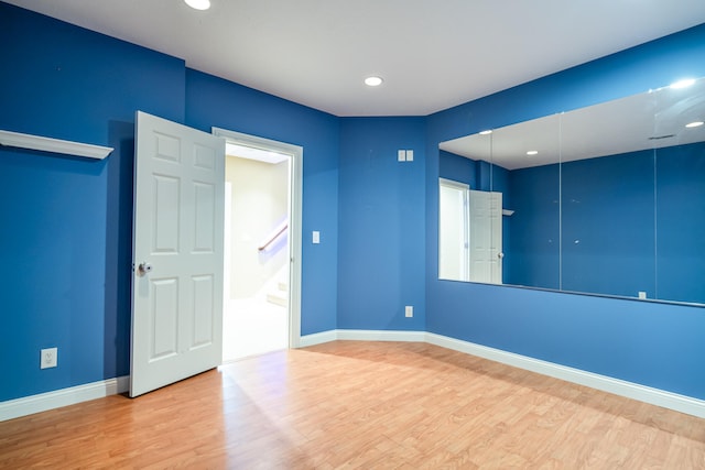 unfurnished room featuring hardwood / wood-style floors