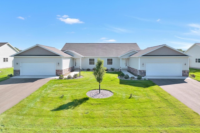 ranch-style home featuring aphalt driveway, stone siding, an attached garage, and a front yard