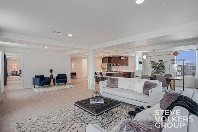 living room with light hardwood / wood-style flooring