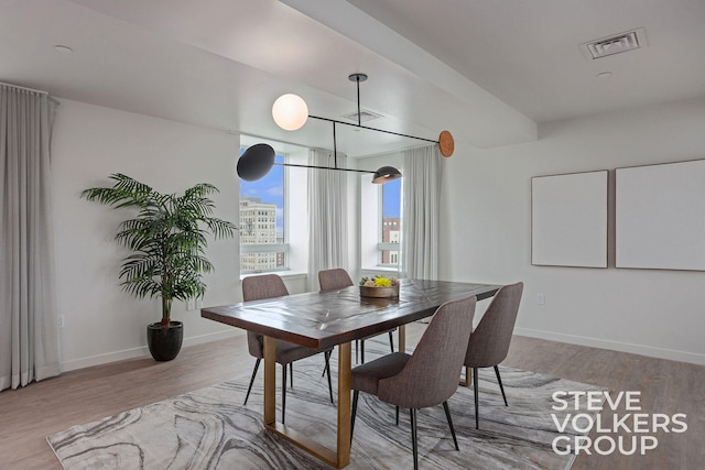 dining space featuring light hardwood / wood-style floors