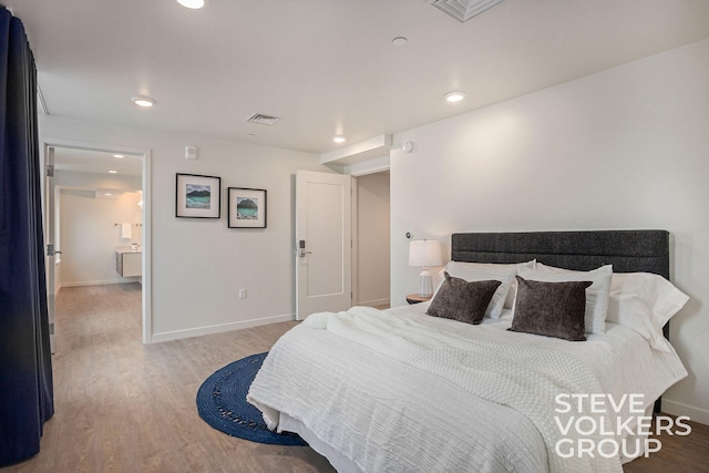 bedroom with light hardwood / wood-style floors