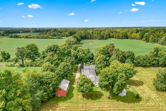 birds eye view of property with a rural view