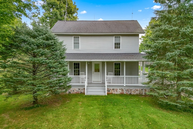 view of front of property featuring a front lawn and a porch