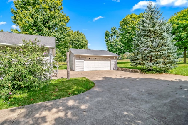 exterior space with a front yard and a garage