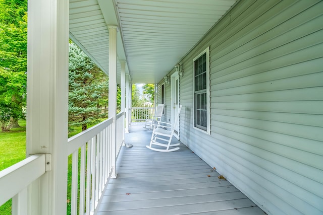 wooden terrace featuring a porch