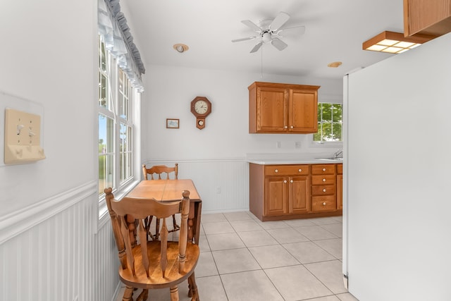 kitchen with white refrigerator, ceiling fan, and light tile patterned flooring