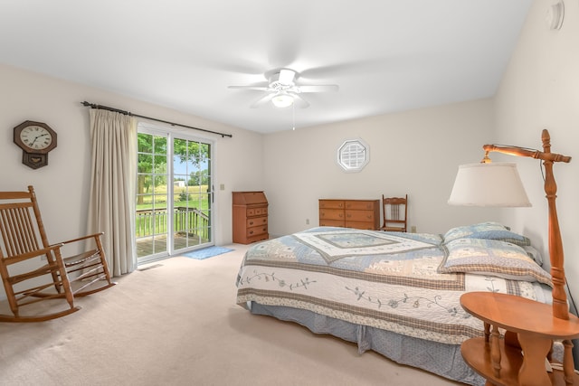 carpeted bedroom with ceiling fan and access to outside