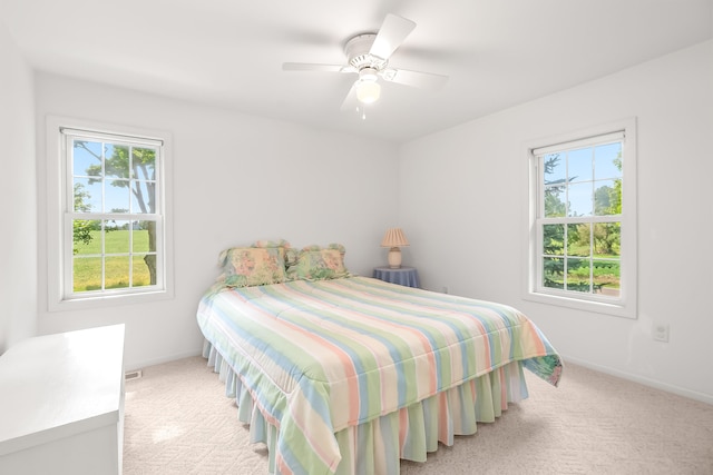 carpeted bedroom featuring ceiling fan