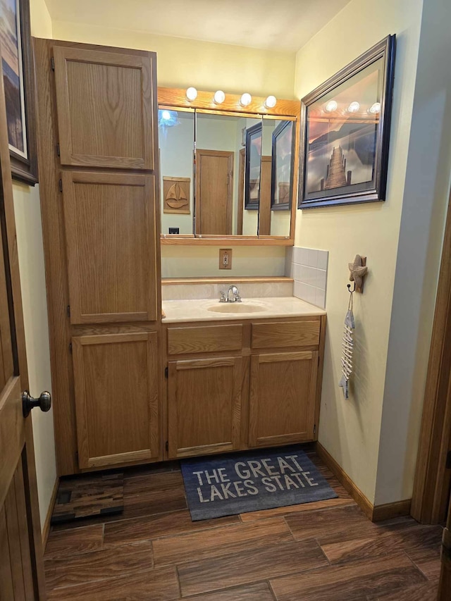 bathroom with vanity and wood-type flooring