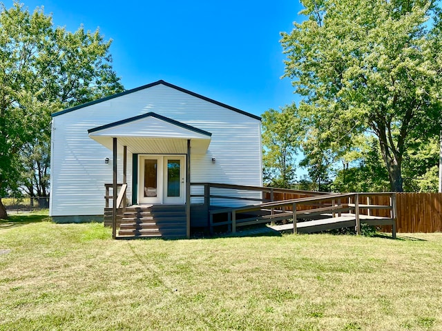 back of house with a yard and a wooden deck