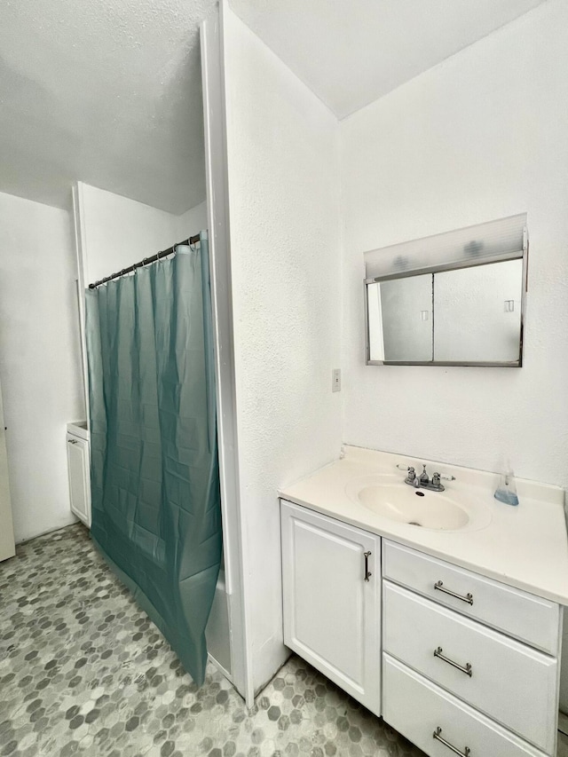 bathroom with vanity and shower / bathtub combination with curtain