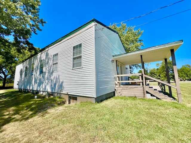 back of house with a yard