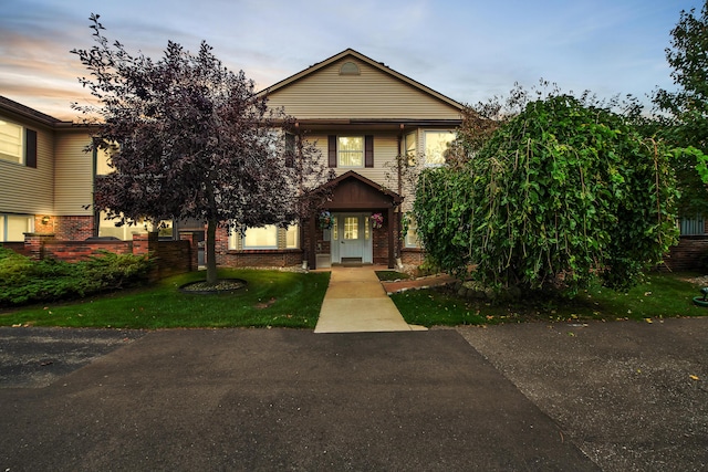 view of front of house featuring brick siding