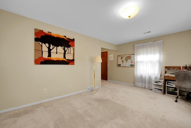 carpeted home office with visible vents and baseboards